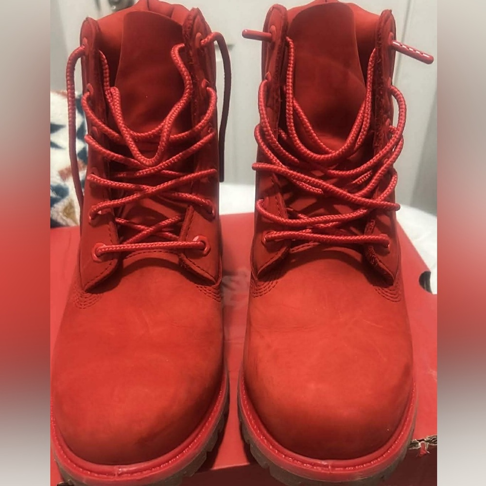 Red women’s red Timb boots 50th anniversary edition.